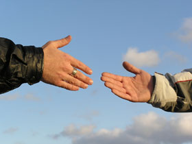 Near hands Hands reaching toward each other about to make contact.