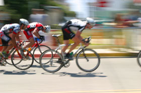 Cycle racer breaking away from the pack just as the competitive advantage we provide helps you do the same.